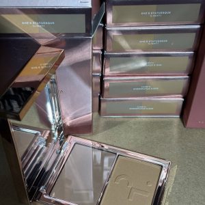 Assorted brands of mixed makeup products.